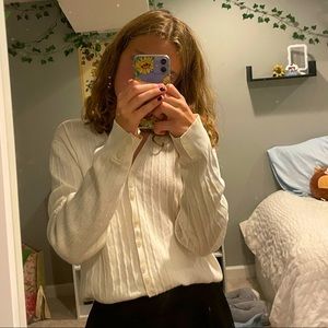 White button-down sweater with knitted look.